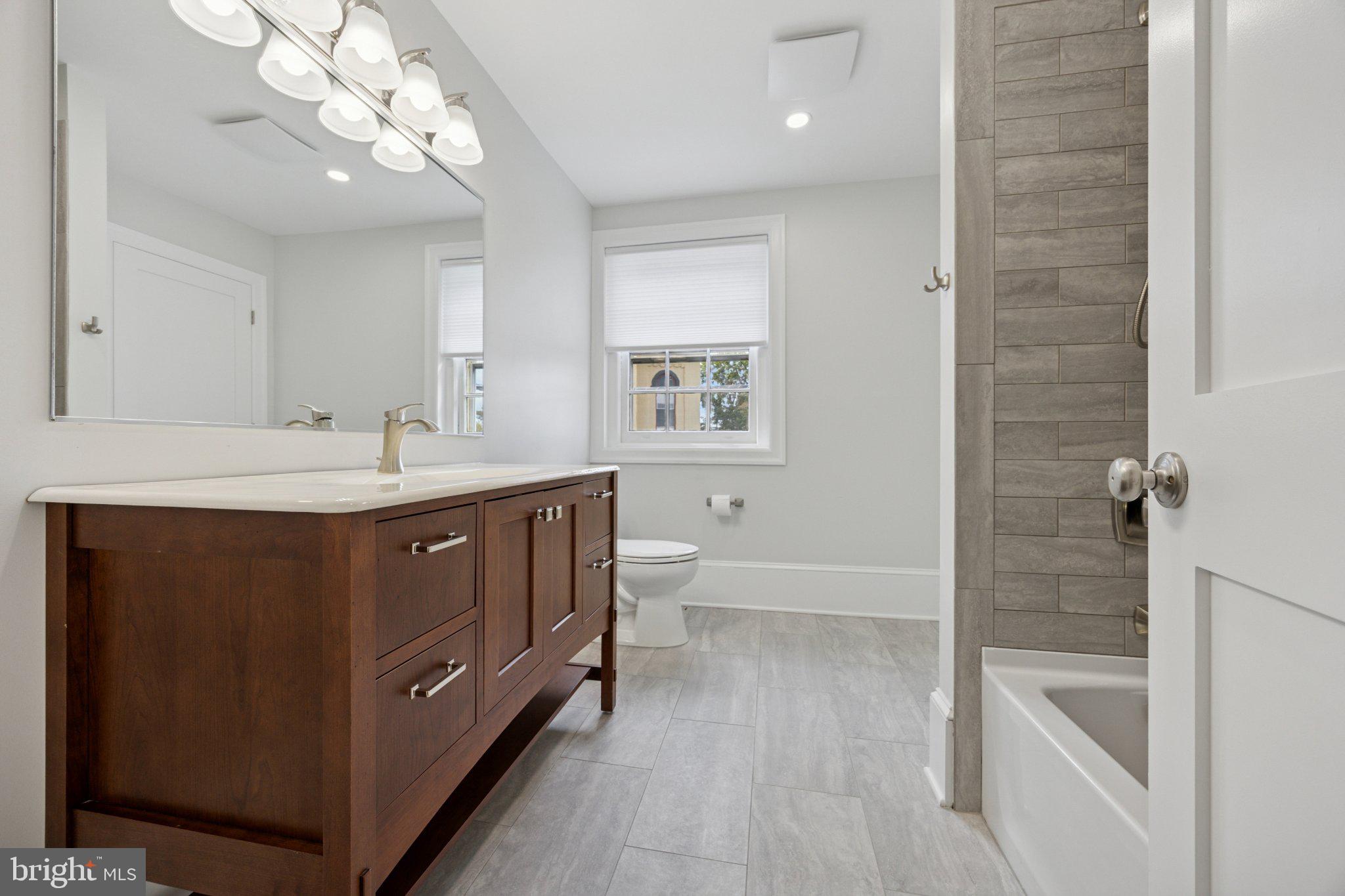 21 South Clinton Street, Unit 2 Doylestown, PA 18901 - Photo 4 of 13 Modern elegance in a serene bathroom.