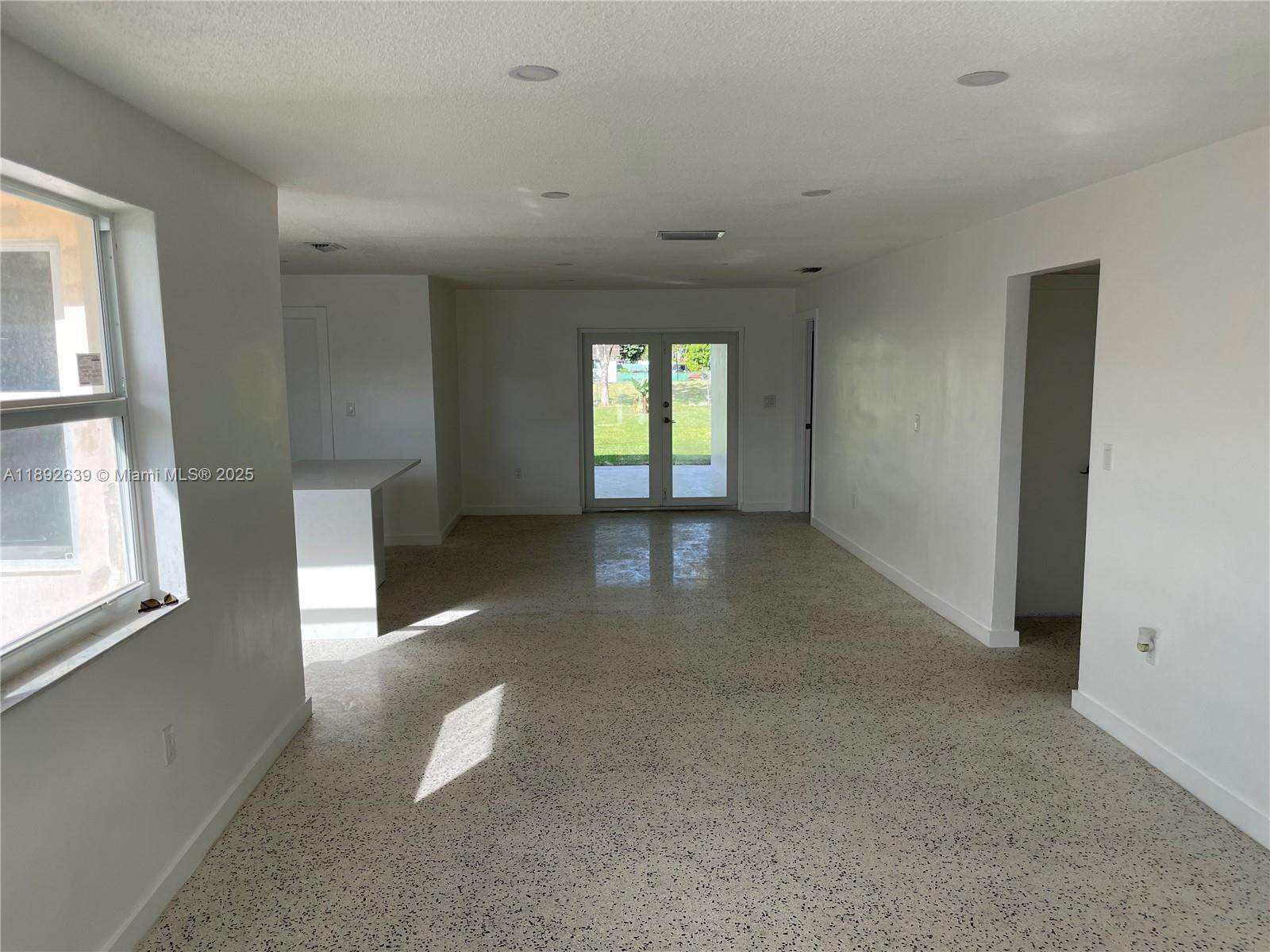 2250 Southwest 69th Avenue Miami, FL 33155 - Photo 6 of 14 an empty room with windows