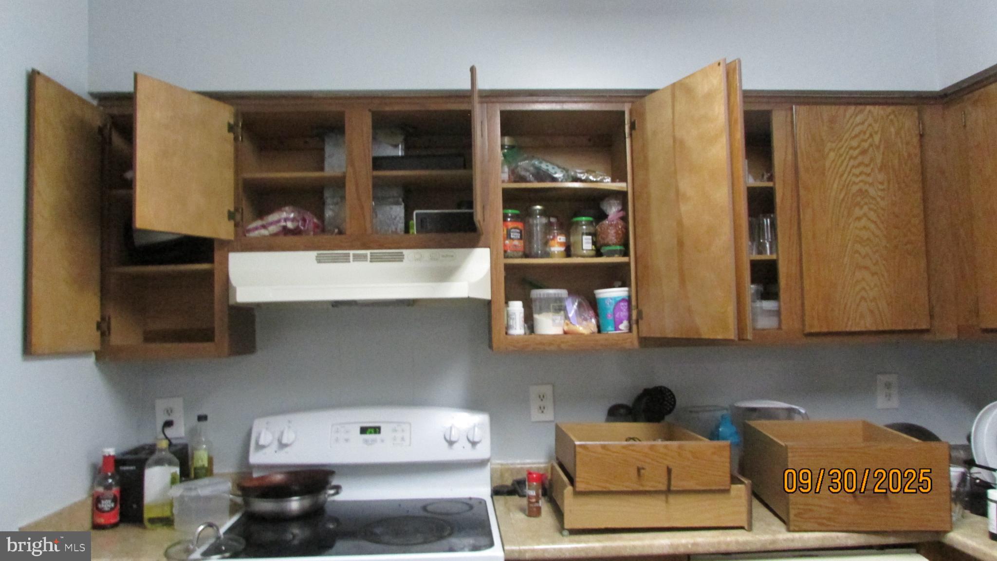 4805 Berwyn House Road, Unit A4805 College Park, MD 20740 - Photo 5 of 17 Cozy kitchen with wooden cabinets open wide.