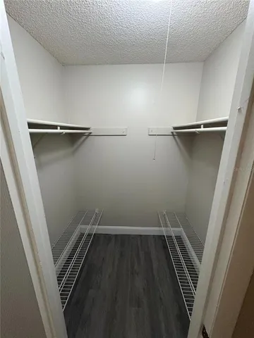 a view of storage and utility room with racks on the wall