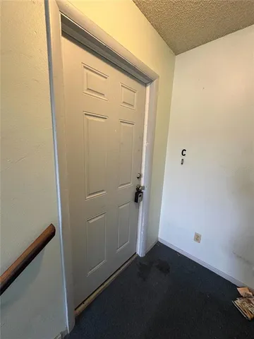 an empty room with wooden floor