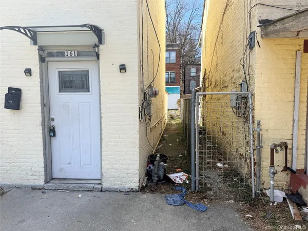 a view of a house with a door and a door