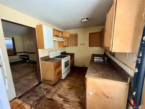a kitchen with sink a counter top space and appliances