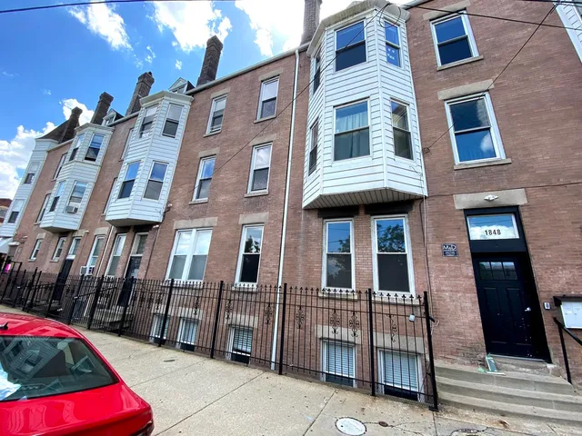 a front view of a multi story residential apartment building