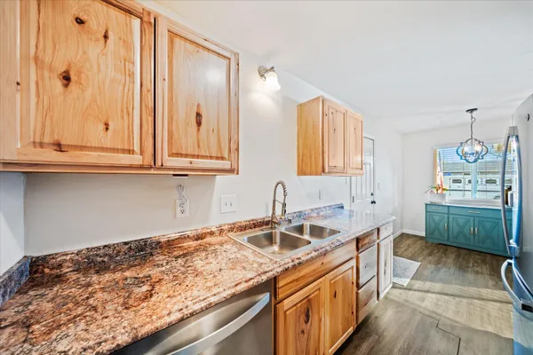 a kitchen that has a sink and a stove