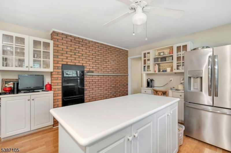 1 Crest Drive Bernards, NJ 07920 - Photo 11 of 21 a kitchen with stainless steel appliances a refrigerator and a stove top oven