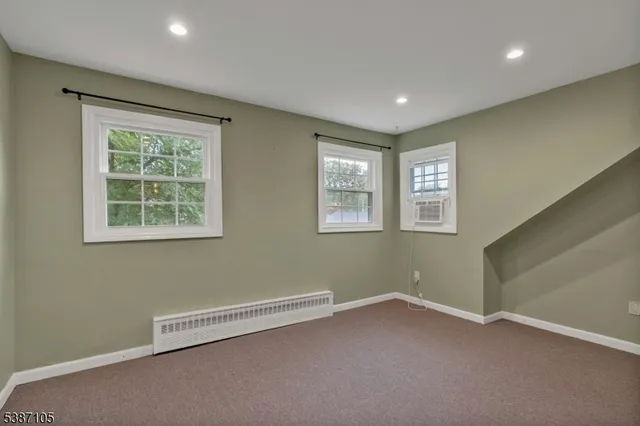 a view of empty room with windows