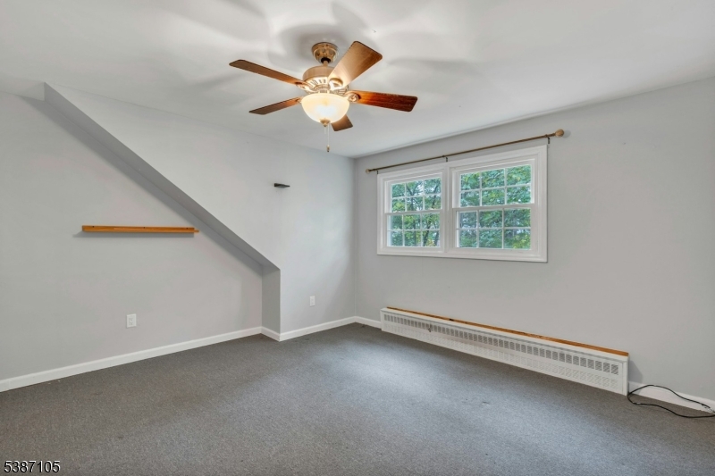 1 Crest Drive Bernards, NJ 07920 - Photo 15 of 21 an empty room with windows and fan