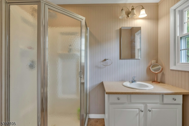 1 Crest Drive Bernards, NJ 07920 - Photo 16 of 21 a bathroom with a sink vanity and a mirror