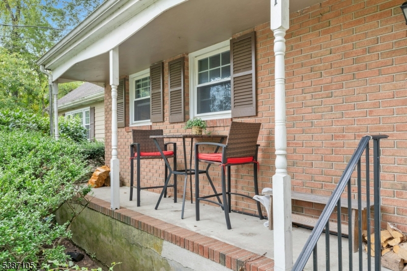1 Crest Drive Bernards, NJ 07920 - Photo 18 of 21 a balcony with table and chairs and potted plants