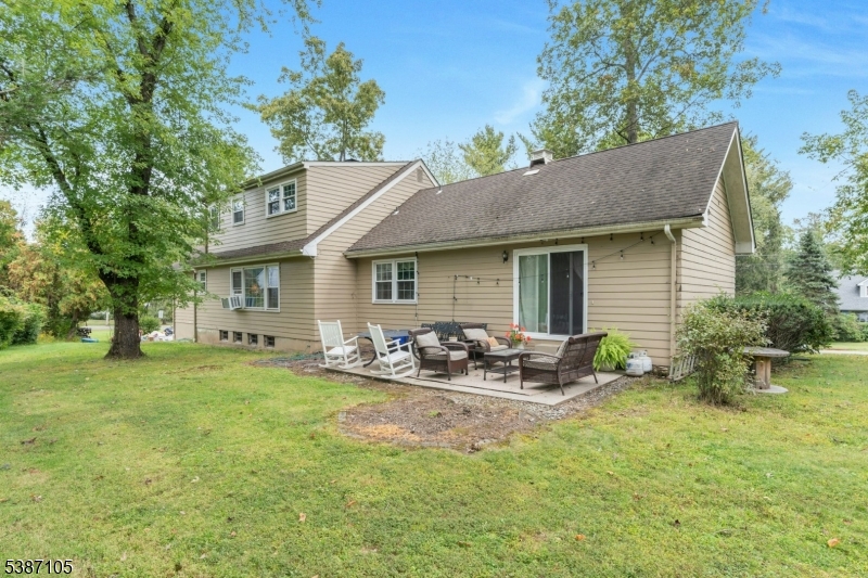 1 Crest Drive Bernards, NJ 07920 - Photo 20 of 21 a backyard of a house with table and chairs