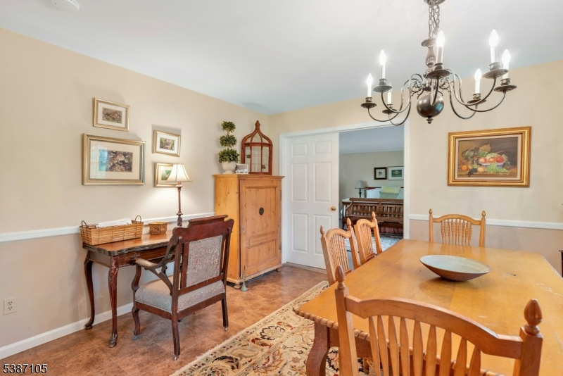1 Crest Drive Bernards, NJ 07920 - Photo 7 of 21 a view of a dining room with furniture and chandelier
