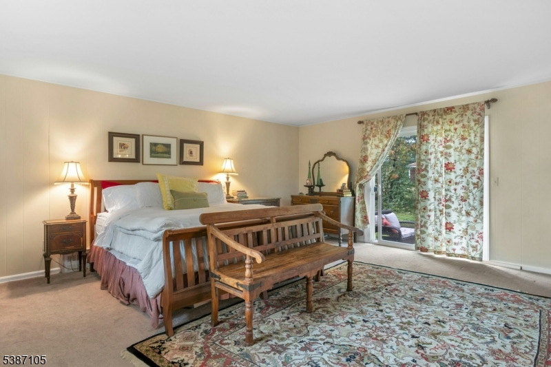 1 Crest Drive Bernards, NJ 07920 - Photo 8 of 21 a bedroom with a bed a table and a window