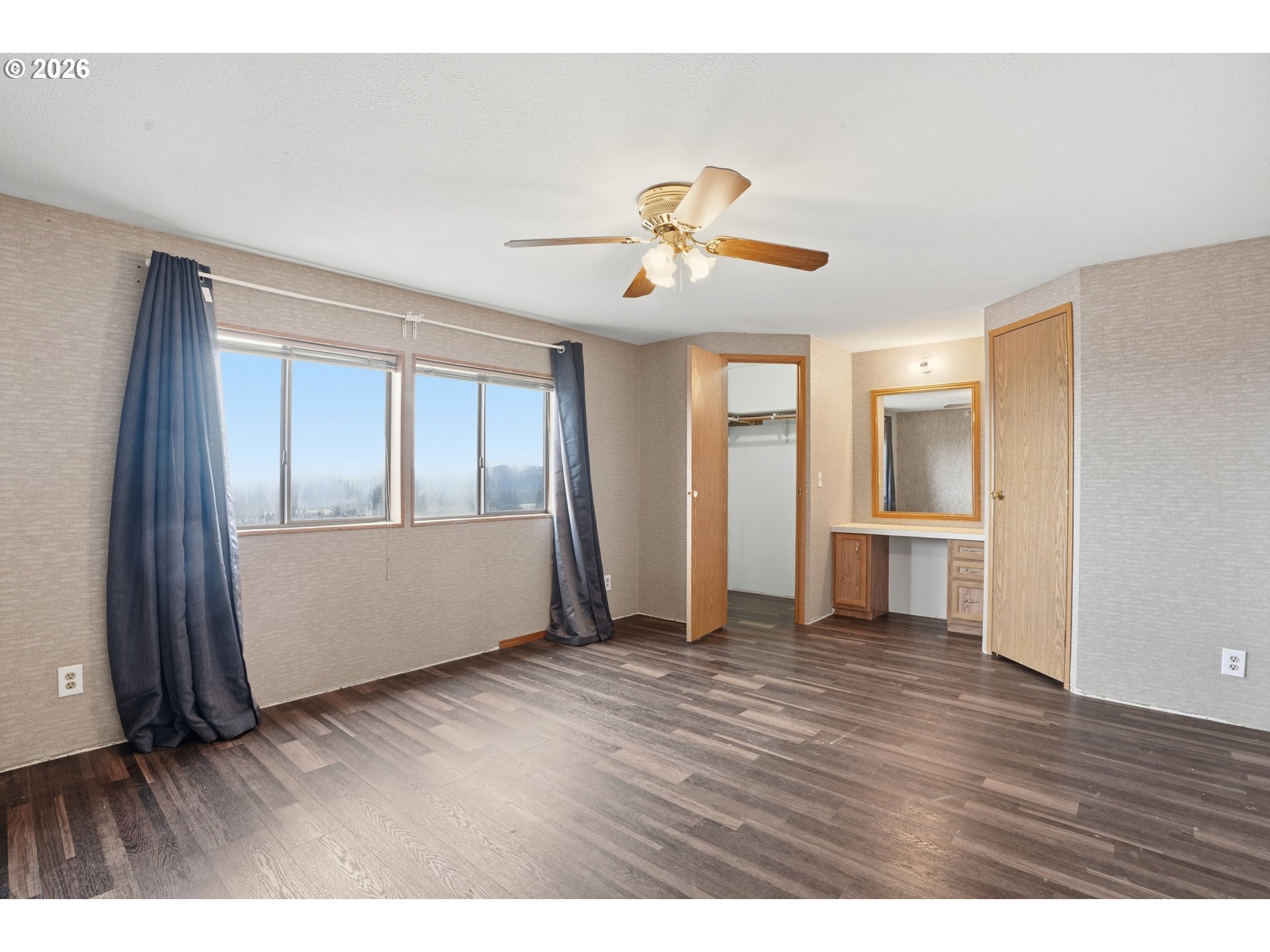 144 Angels Lane Kalama, WA 98625 - Photo 11 of 28 a view of an empty room with window and wooden floor