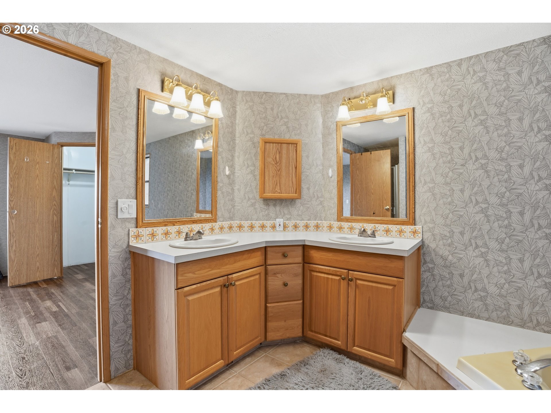 144 Angels Lane Kalama, WA 98625 - Photo 12 of 28 a spacious bathroom with a sink double vanity granite and a mirror