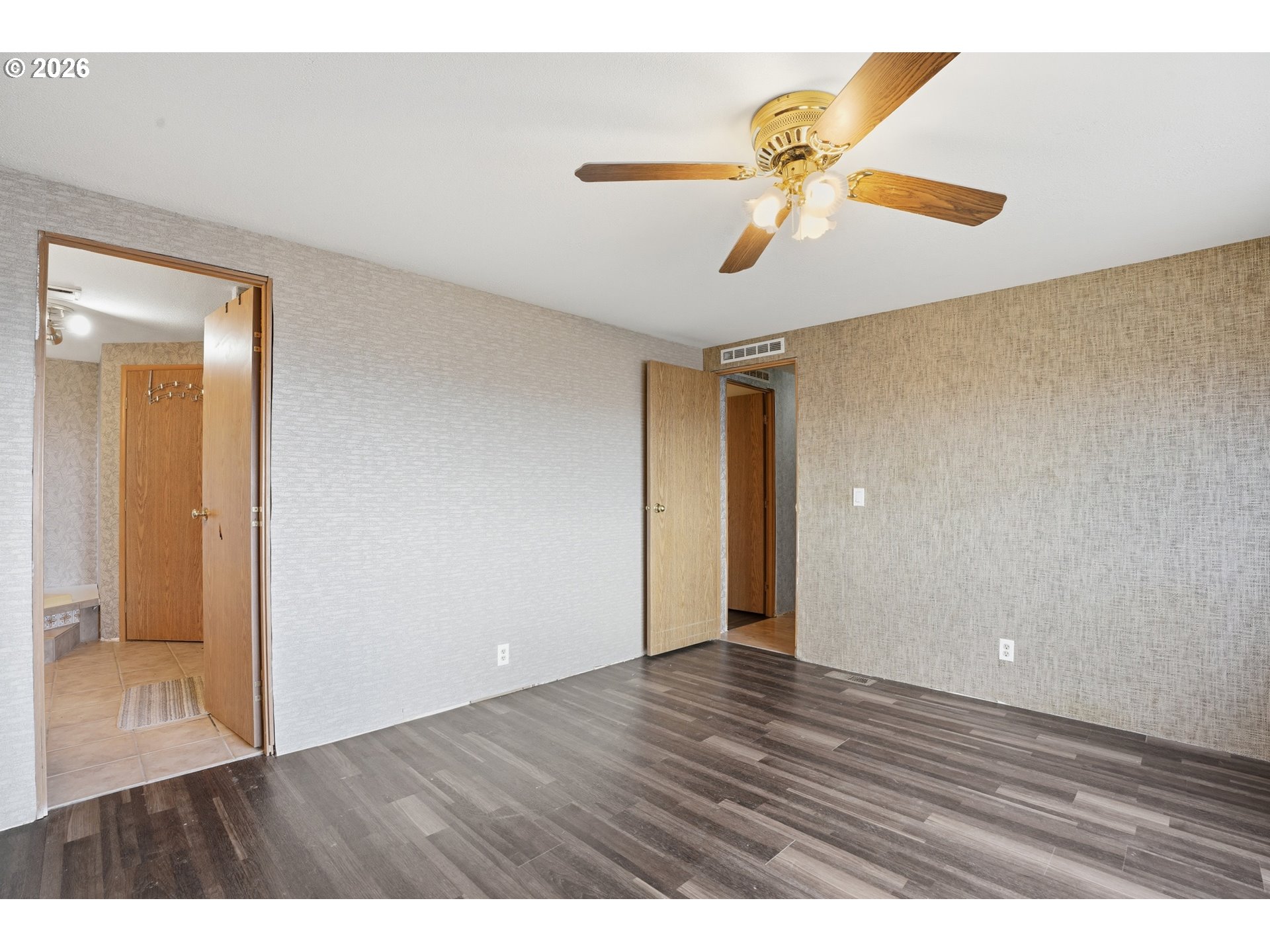 144 Angels Lane Kalama, WA 98625 - Photo 15 of 28 a view of an empty room and wooden floor