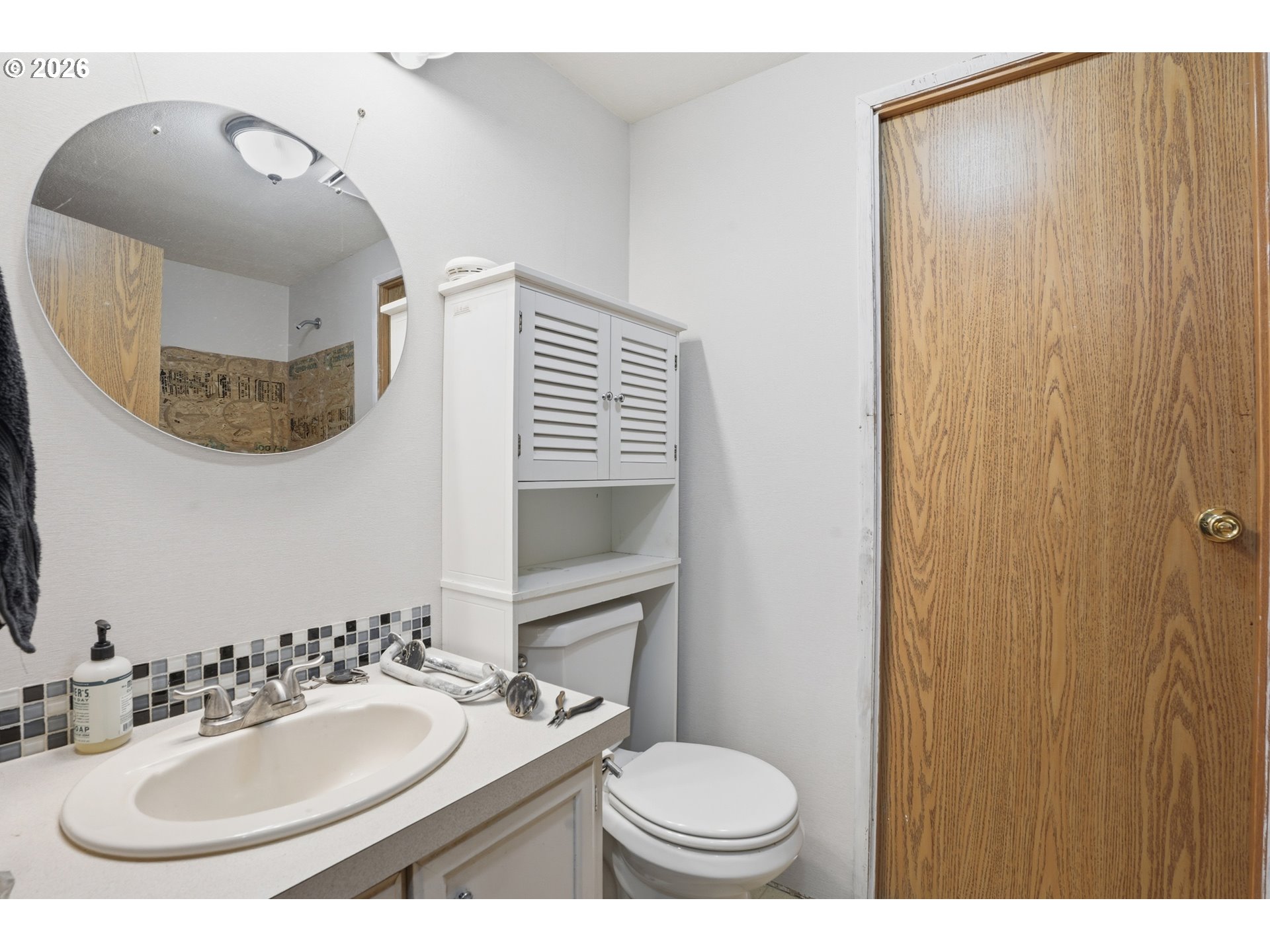 144 Angels Lane Kalama, WA 98625 - Photo 16 of 28 a bathroom with a sink and a mirror