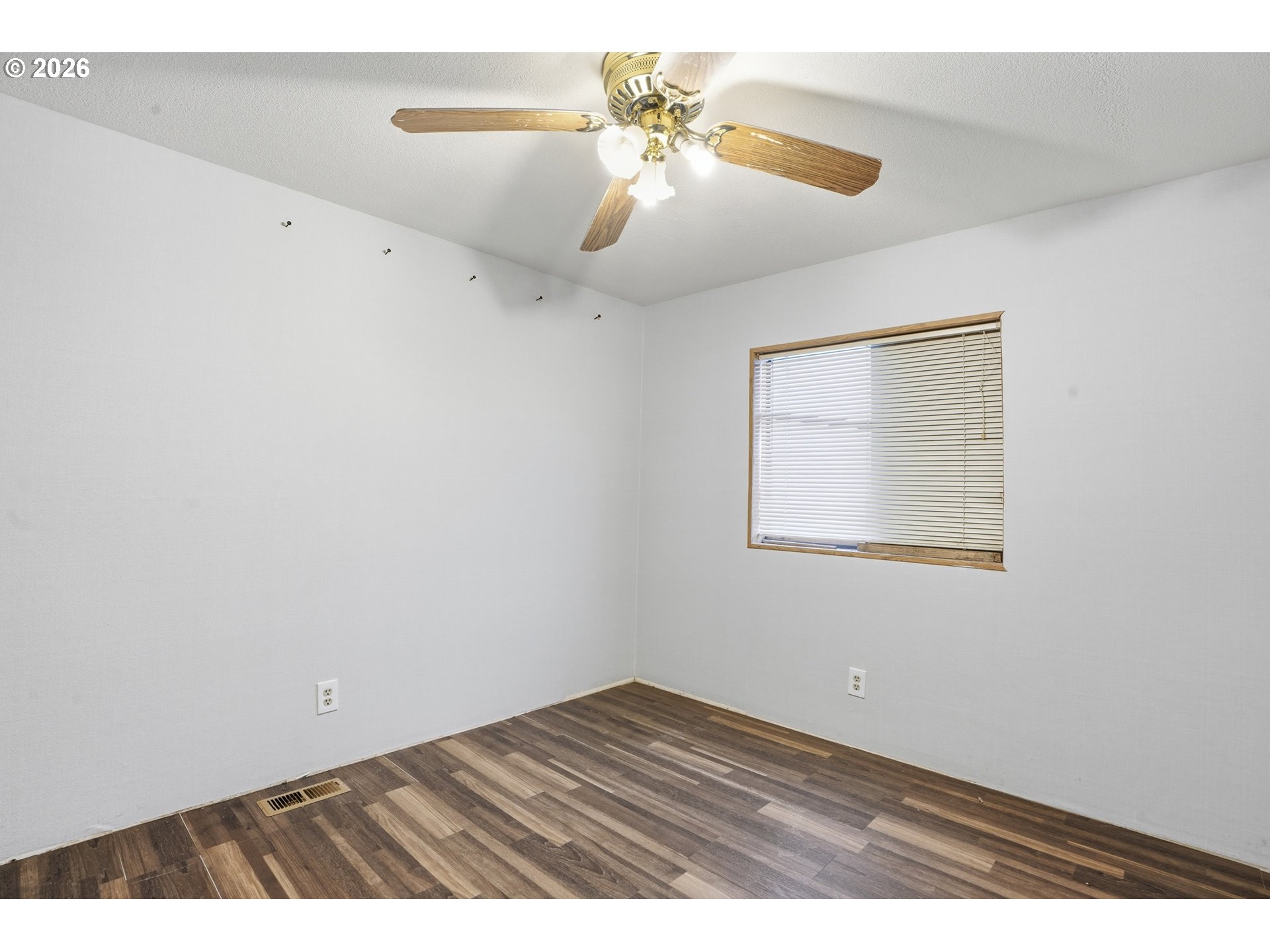 144 Angels Lane Kalama, WA 98625 - Photo 18 of 28 an empty room with wooden floor ceiling fan