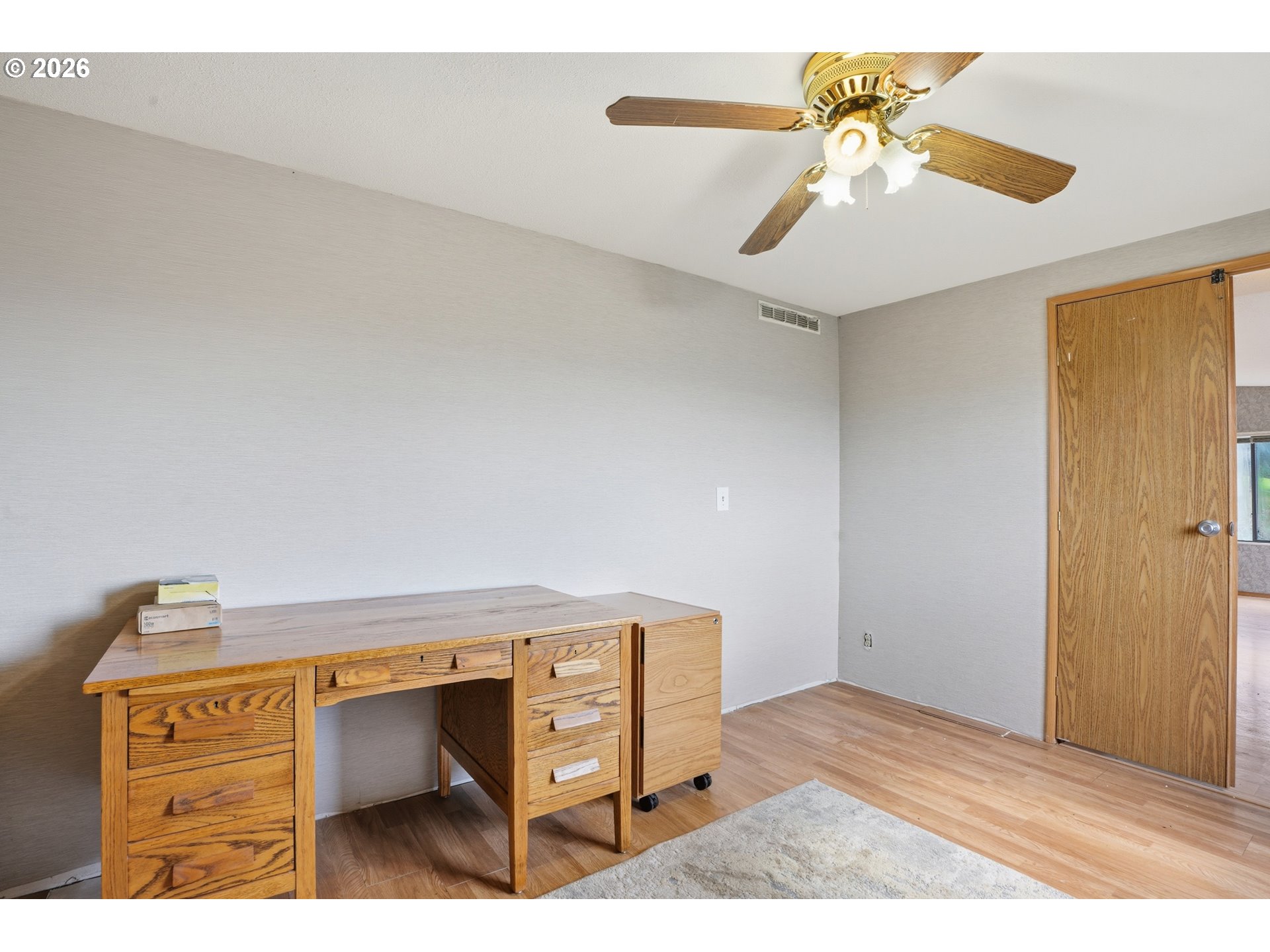 144 Angels Lane Kalama, WA 98625 - Photo 20 of 28 a bedroom with a bed and a chandelier