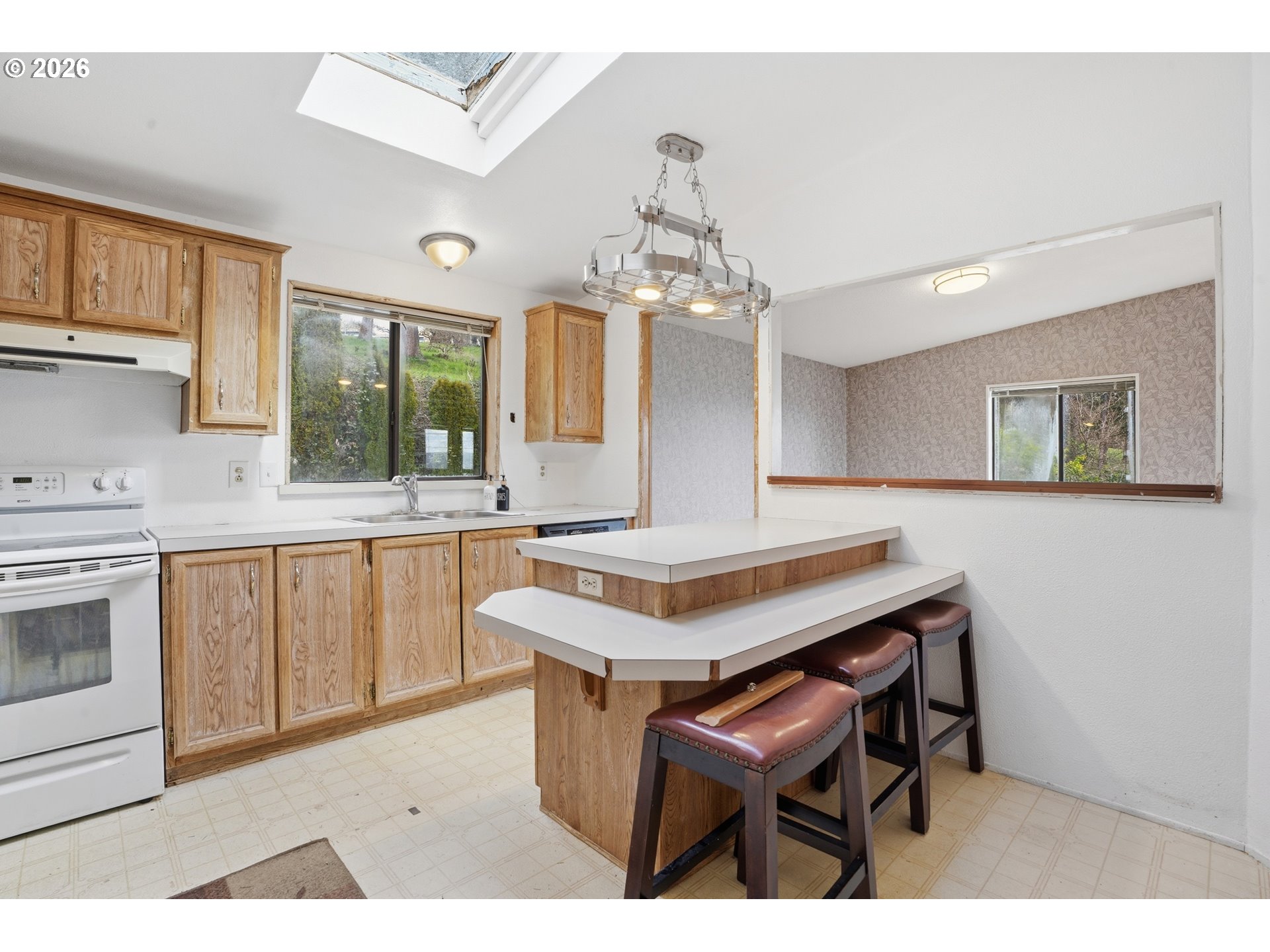 144 Angels Lane Kalama, WA 98625 - Photo 5 of 28 a kitchen with a table chairs and white cabinets
