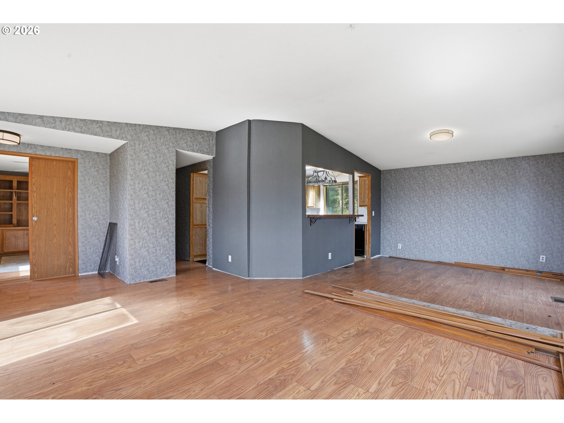 144 Angels Lane Kalama, WA 98625 - Photo 8 of 28 a view of an empty room with window and wooden floor