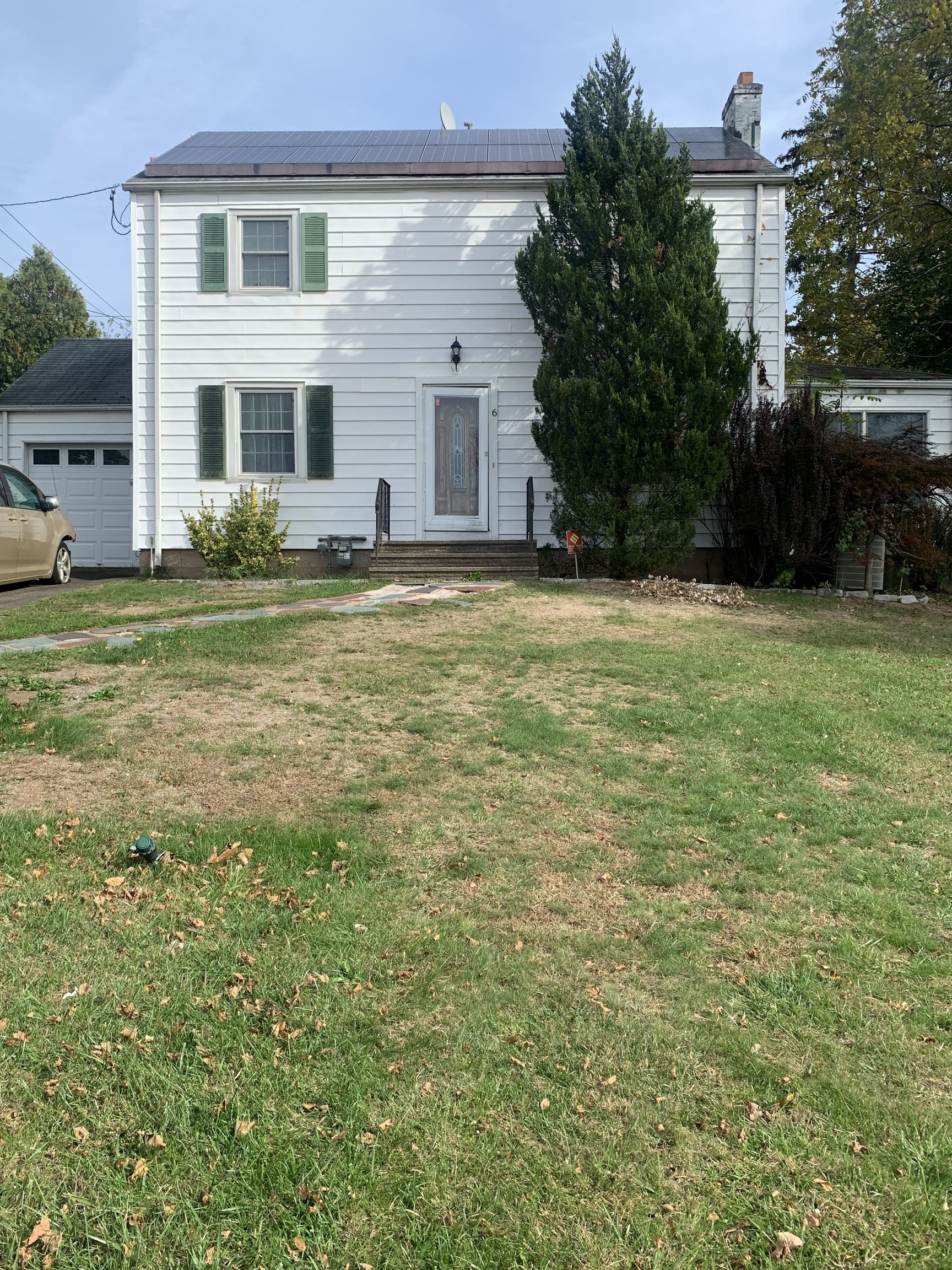 a view of a house with a yard