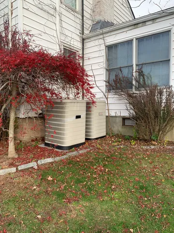 a view of a house with a tree