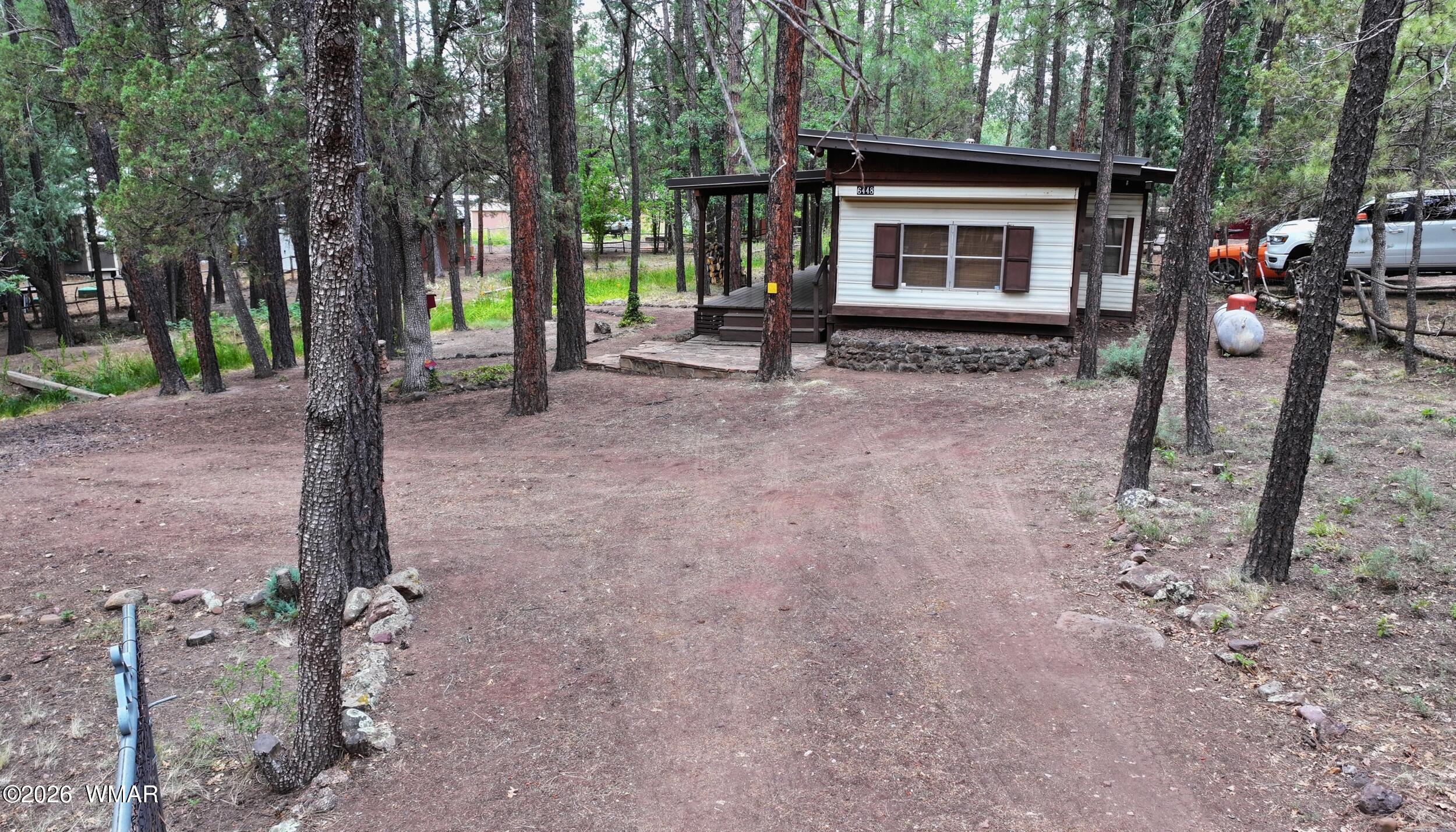 6448 Lower Ridge Drive Lakeside, AZ 85929 - Photo 22 of 24 a front view of a house with garden