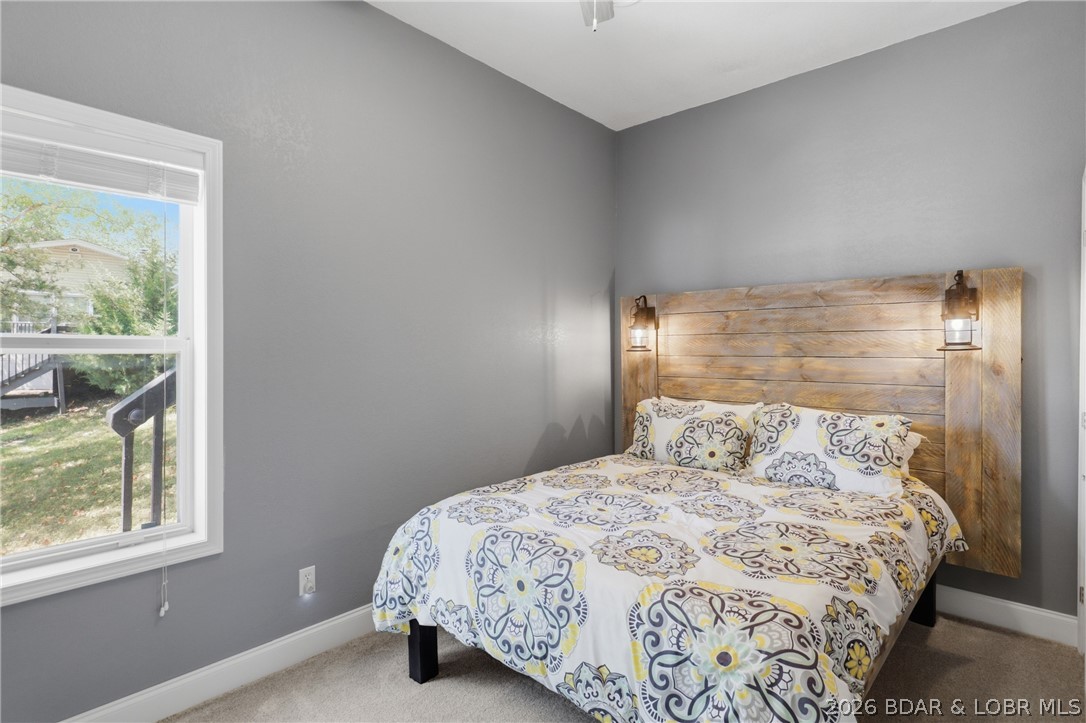 1492 Purvis Road Sunrise Beach, MO 65079 - Photo 32 of 41 Lower-level bedroom with custom made lighted headb
