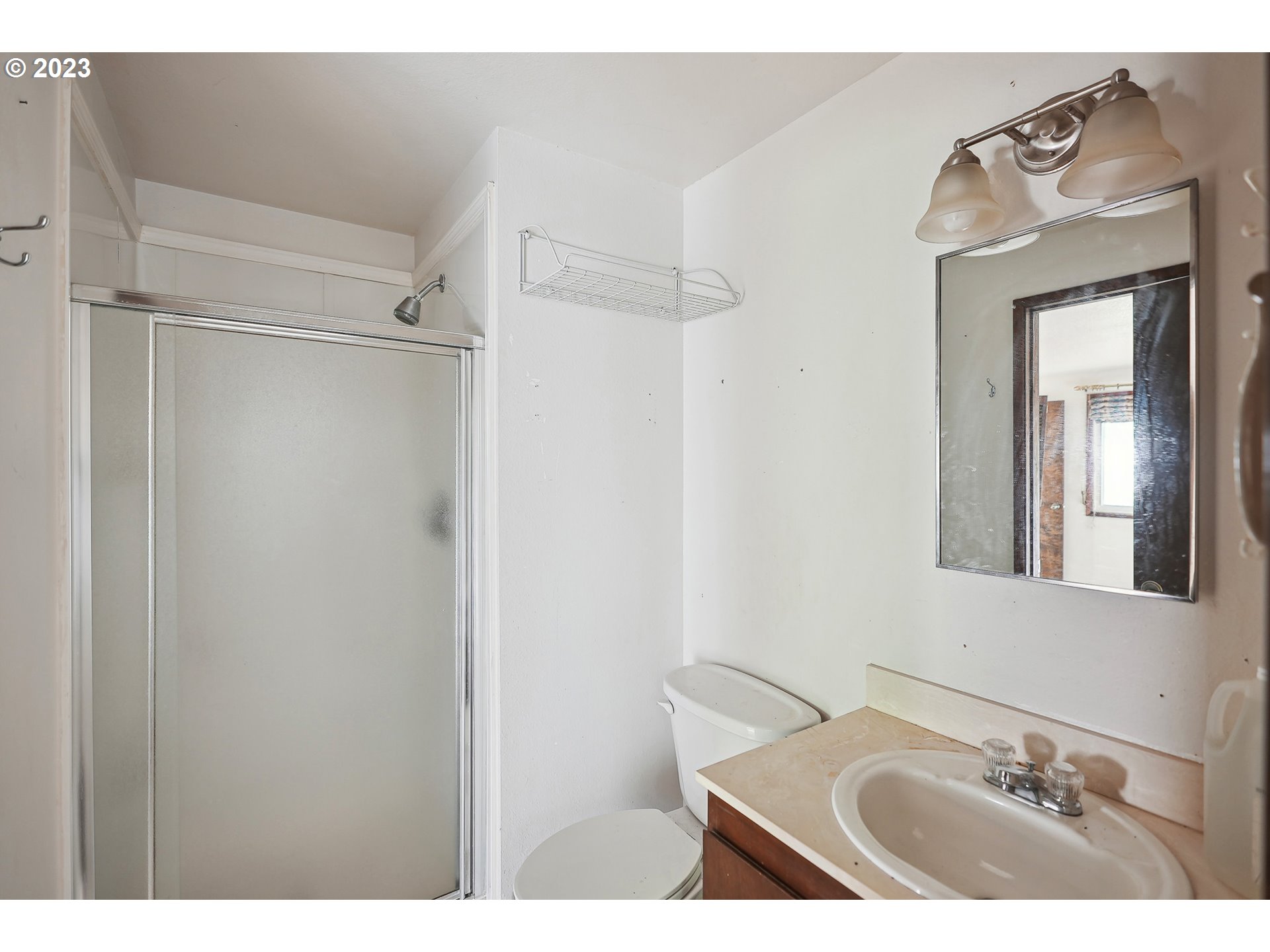 2295 Northeast Juniper Avenue Gresham, OR 97030 - Photo 18 of 25 a bathroom with a sink and a mirror