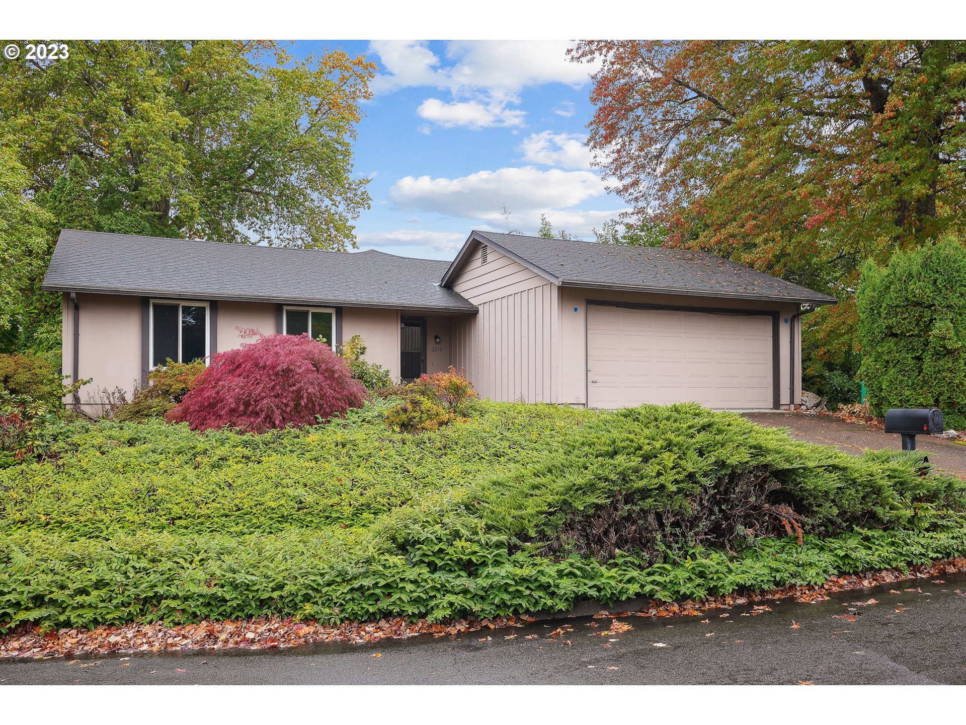 2295 Northeast Juniper Avenue Gresham, OR 97030 - Photo 21 of 25 a front view of house with yard and green space