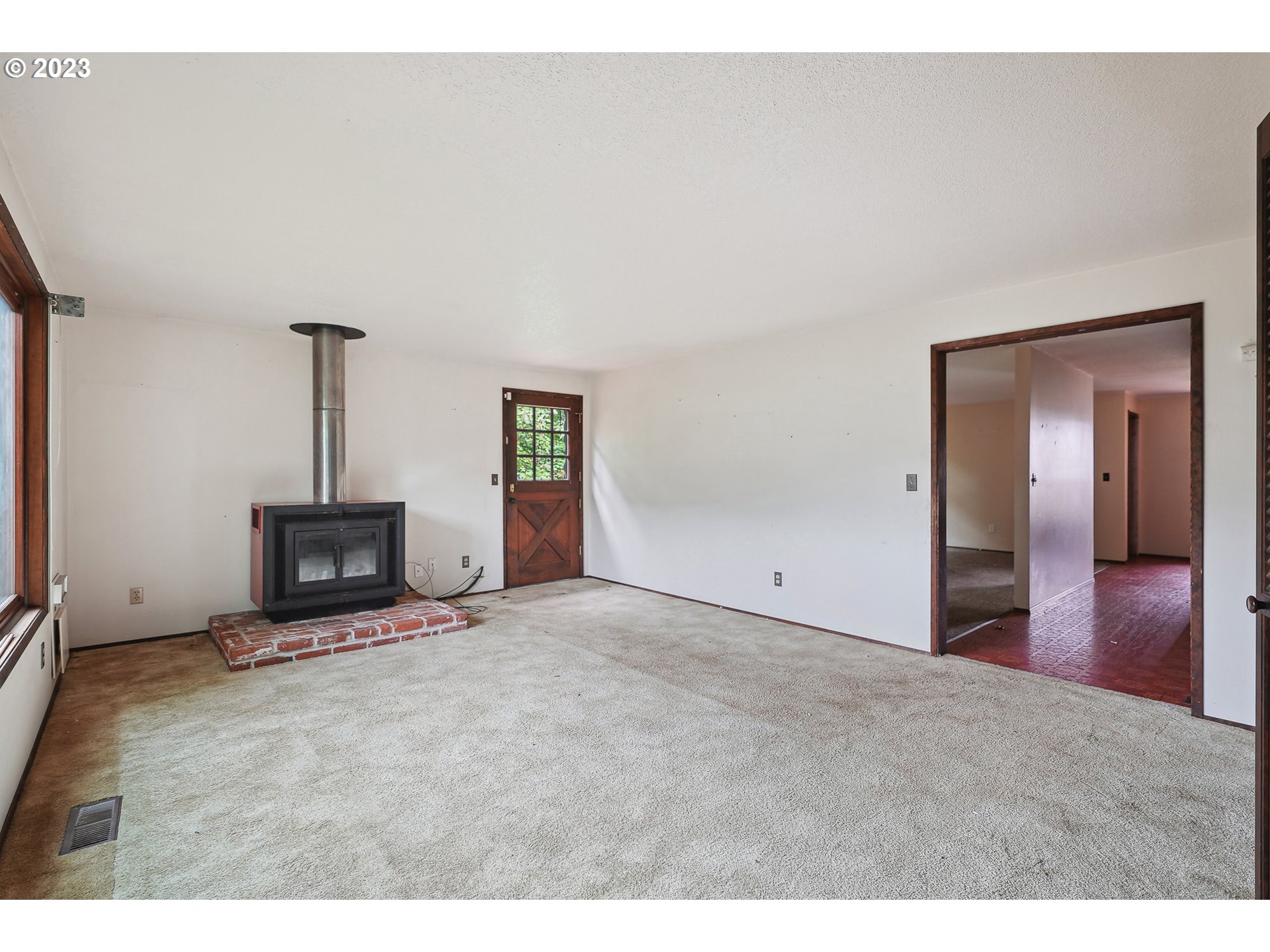 2295 Northeast Juniper Avenue Gresham, OR 97030 - Photo 6 of 25 a view of empty room with a fireplace
