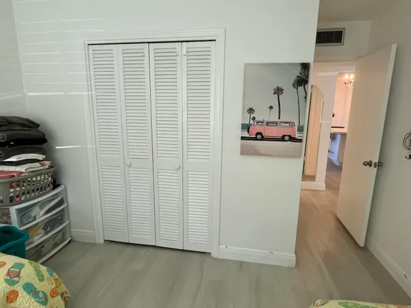 a view of hallway with livingroom and stairs
