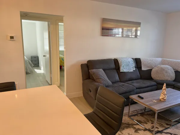 a living room with furniture and a table