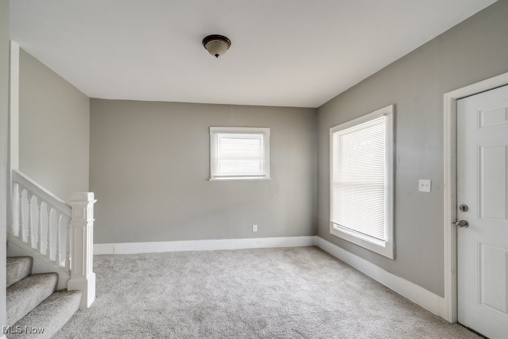 1261 Rozelle Avenue Cleveland, OH 44112 - Photo 4 of 32 Carpeted spare room featuring a healthy amount of sunlight