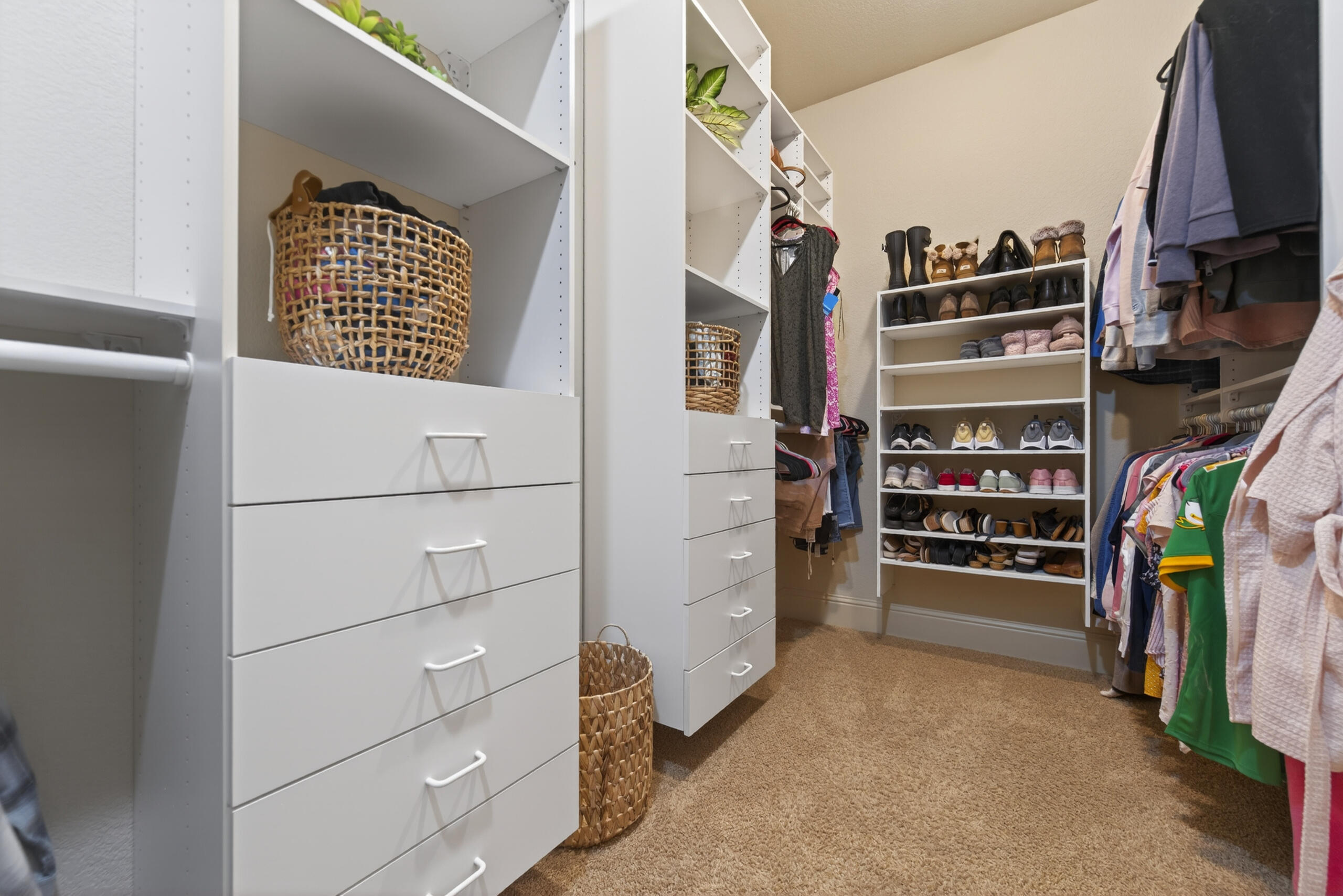 9009 Merlin Drive Redmond, OR 97756 - Photo 37 of 98 a view of walk in closet with clothes and shoes