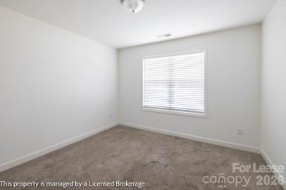 100 Henson Street Albemarle, NC 28001 - Photo 16 of 24 an empty room with a window