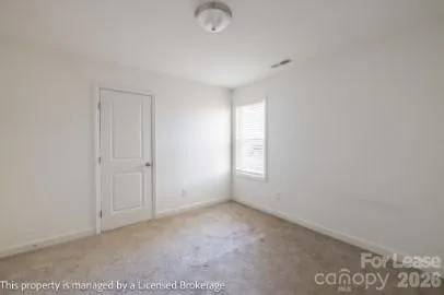 a view of an empty room and window