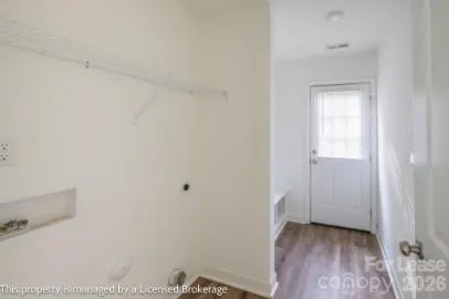 a view of a room with wooden floor and closet