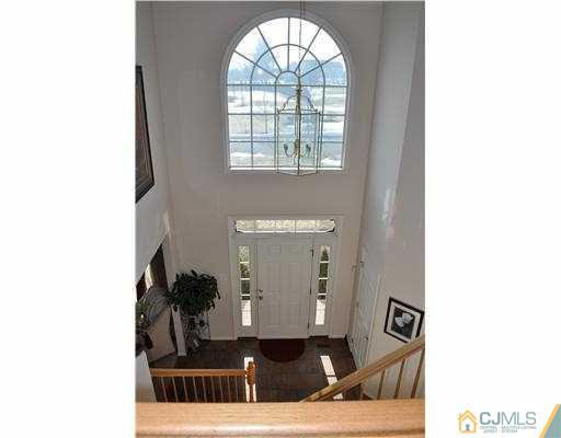 24 Sunflower Road Somerset, NJ 08873 - Photo 2 of 15 a living room with furniture and a window
