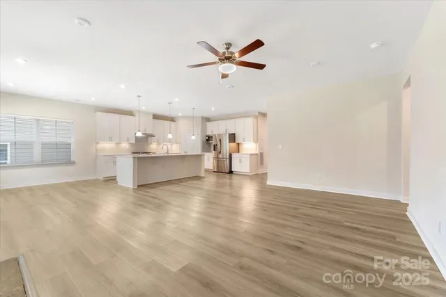 a view of a livingroom with a kitchen