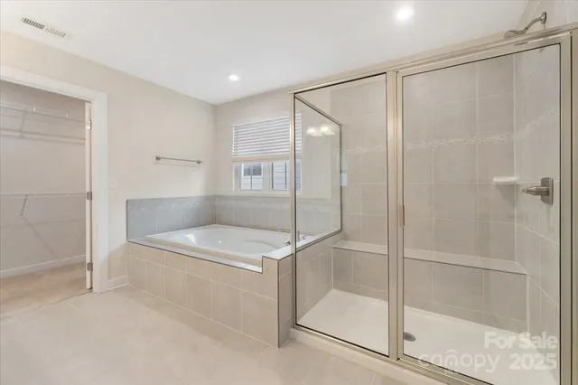 a bathroom with a shower and a sink