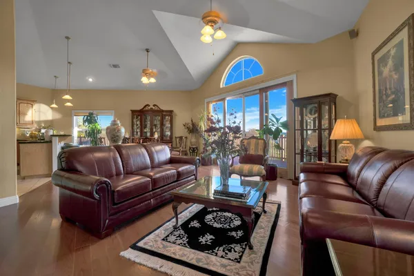 a bedroom with a bed and a flat tv screen on wall