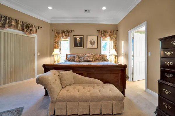 a view of a house with a yard and garage