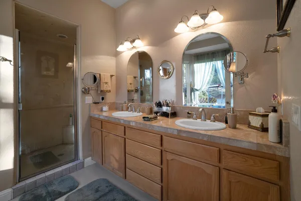 a view of a chair and table in backyard of the house