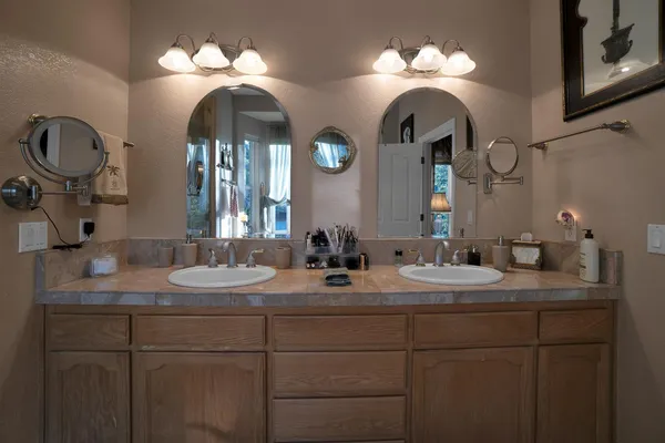 an aerial view of a house with a yard basket ball court and outdoor seating