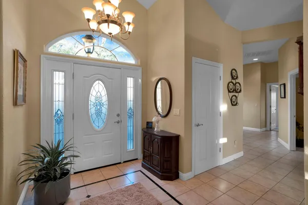 a living room with furniture fireplace and a large window