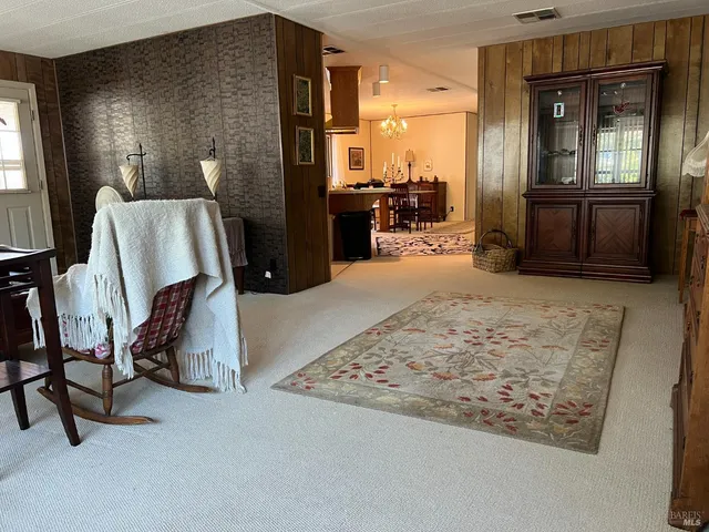 a view of a hallway with seating area
