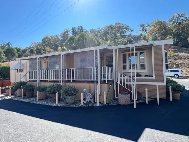 a view of a chair and table on the wooden floor