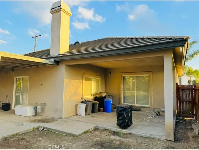 a view of a patio with table and chairs